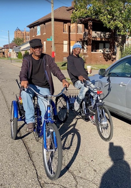 Two cyclists on a residential street in Northwest Goldberg, Detroit